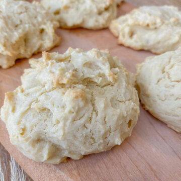 Easy Vegan Drop Biscuits on a wooden cutting board.