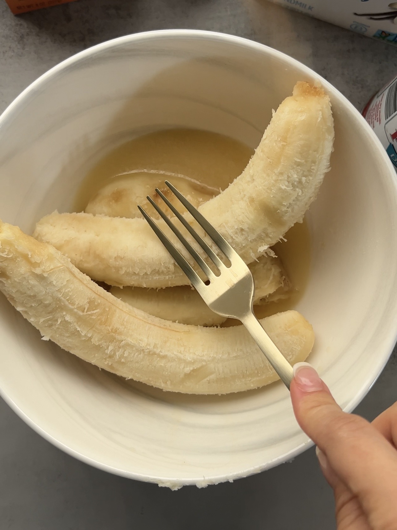 Mashing the overripe bananas.