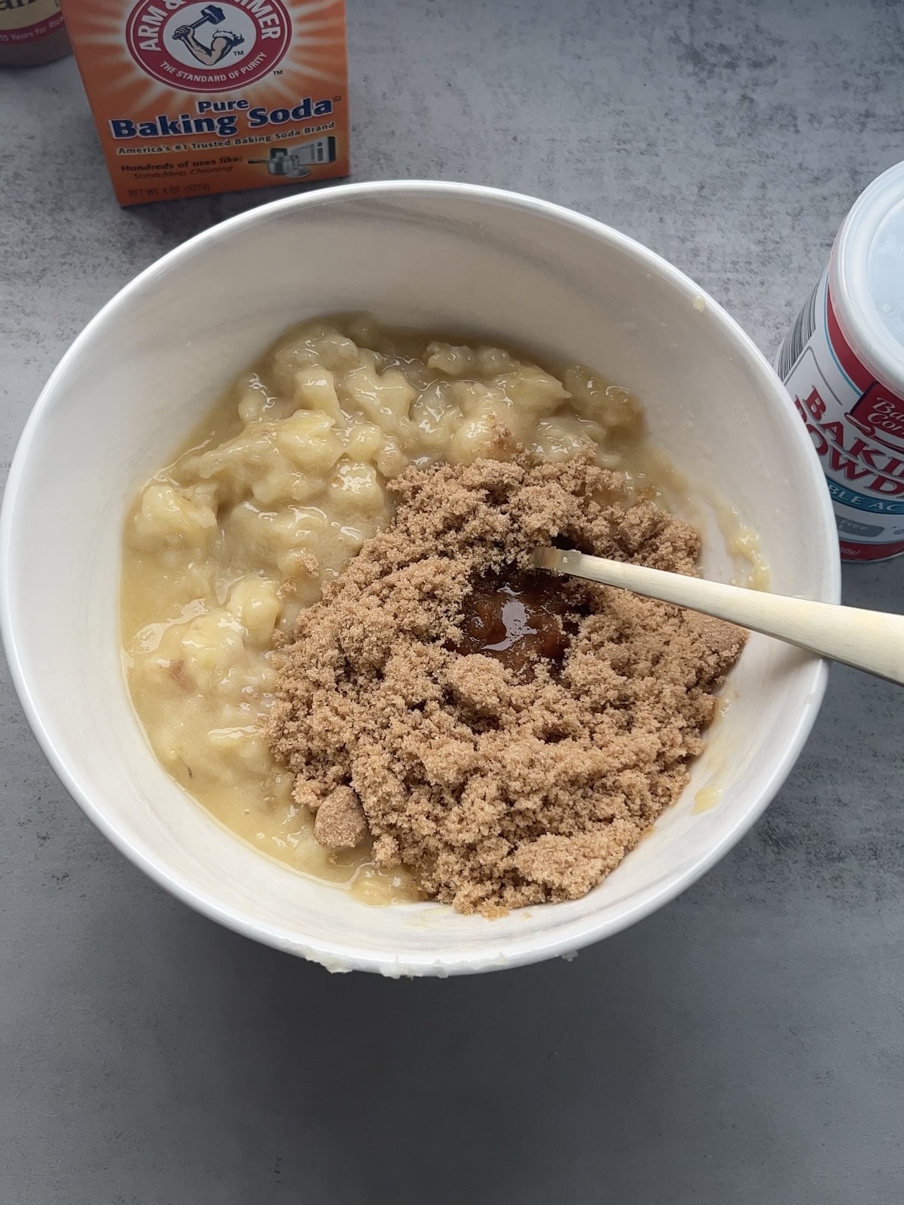 Adding the brown sugar to the bowl.