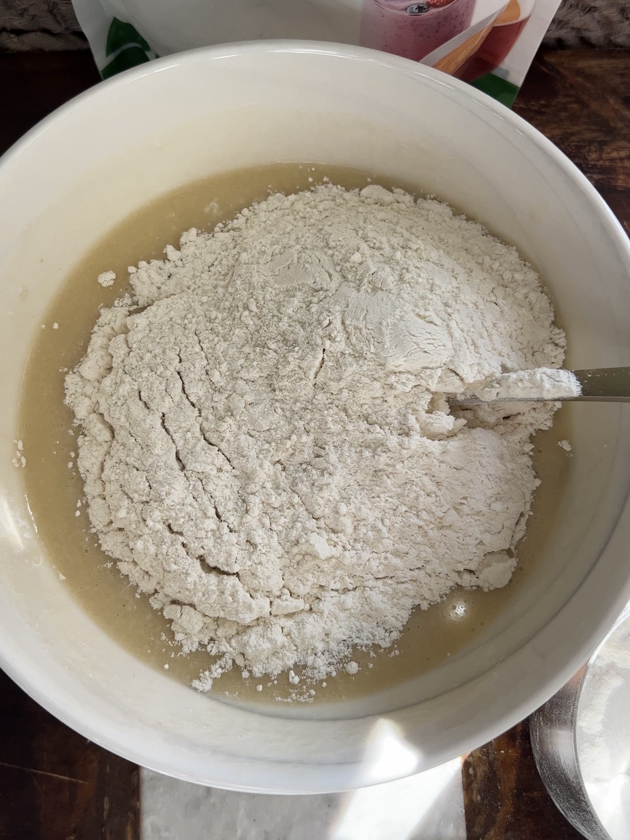 adding the flour to the cookie dough