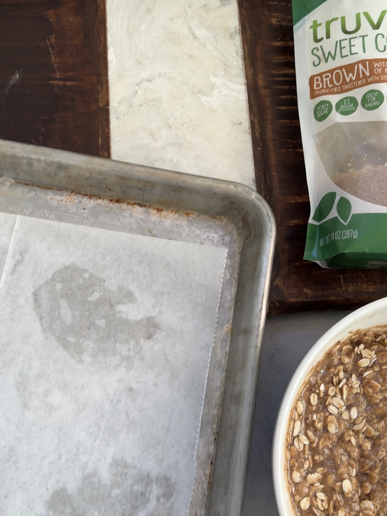 preparing the baking sheet iced oatmeal cookies