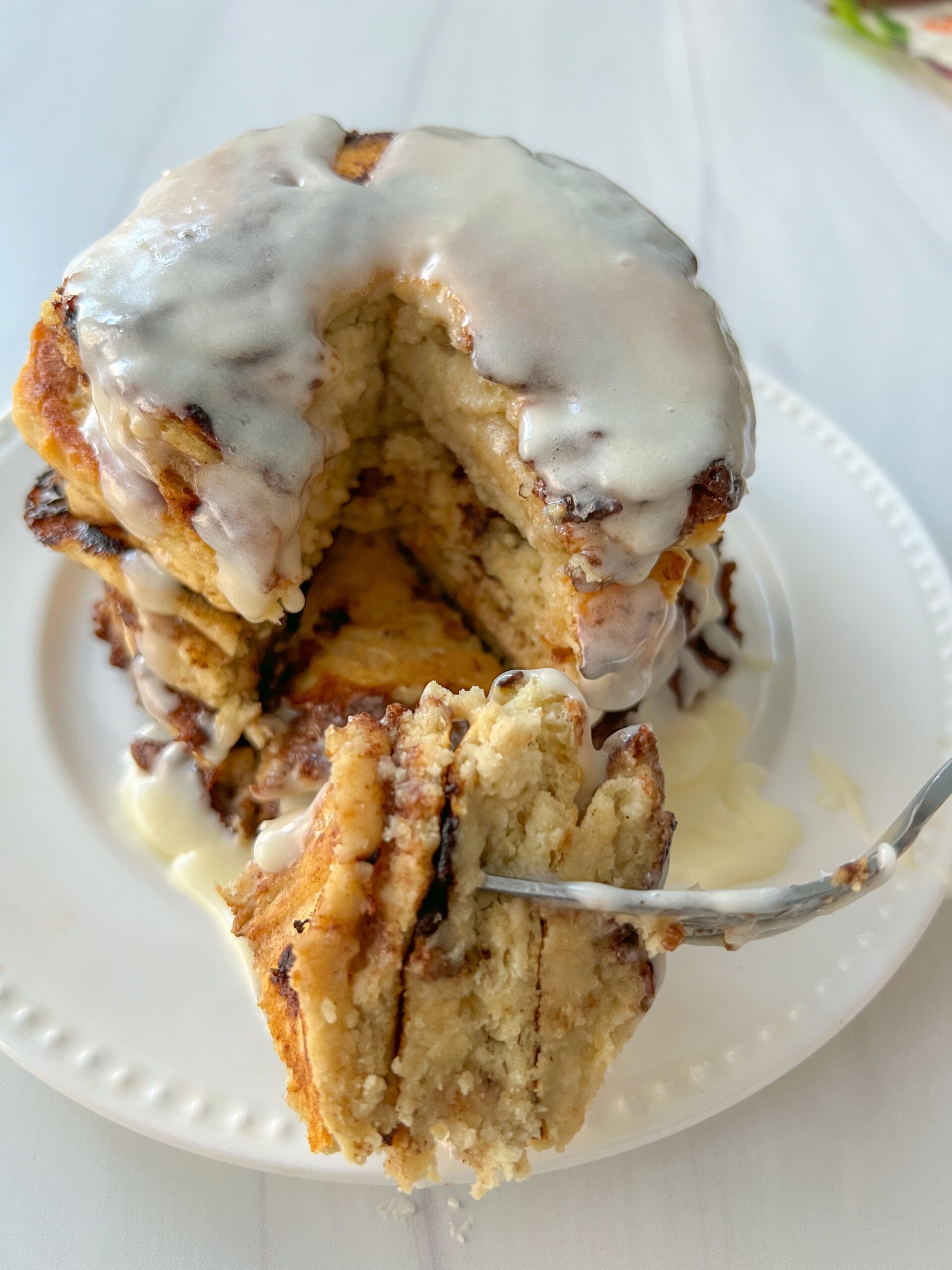 Can't decide between a golden and buttery cinnamon roll or a fluffy stack of pancakes? Get the best of both worlds with these delicious and indulgent Cinnamon Roll Pancakes. This is an easy recipe that is vegan and gluten-free friendly.