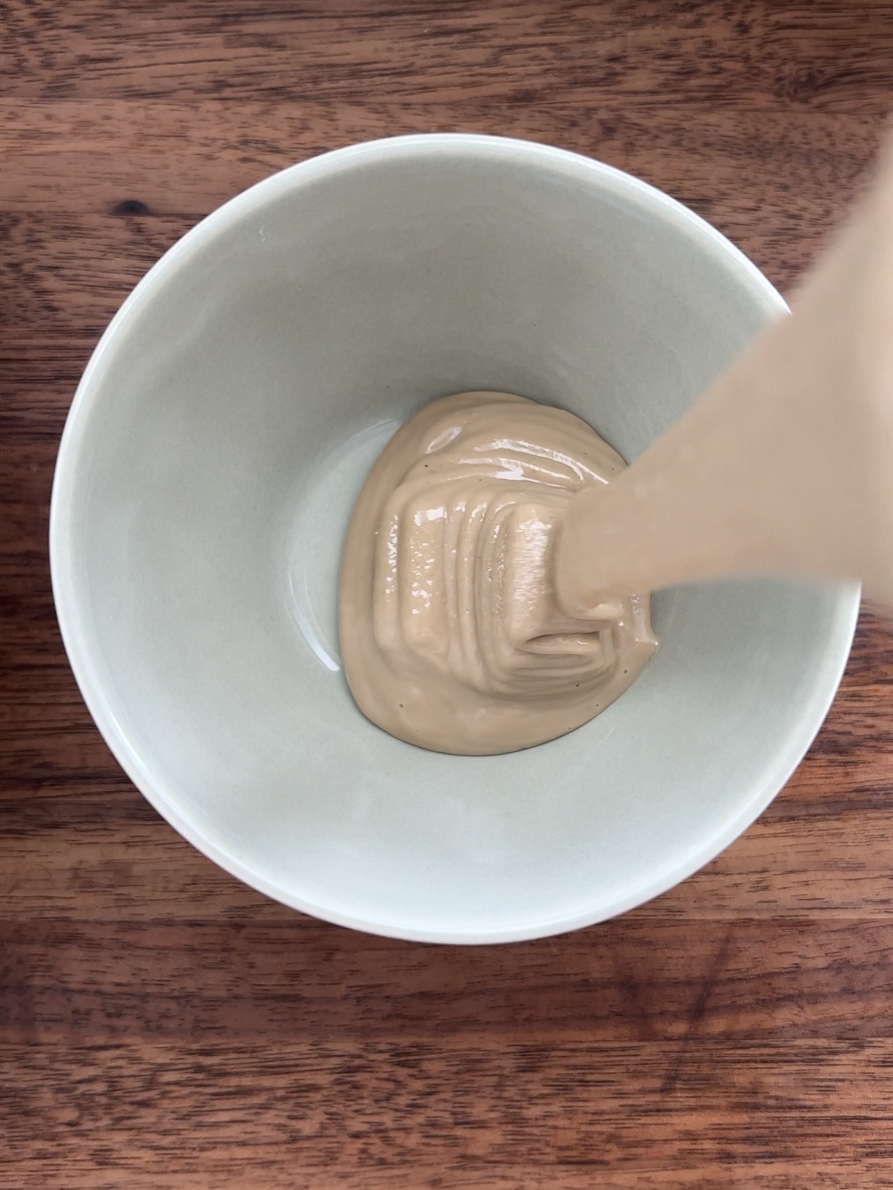 Step 4: Make the Lemon Tahini Dressing to drizzle over the top of the roasted chickpeas and broccoli. To make the dressing, mix the tahini, lemon juice, water, yogurt, and garlic powder together until smooth. Drizzle over your bowl before serving.