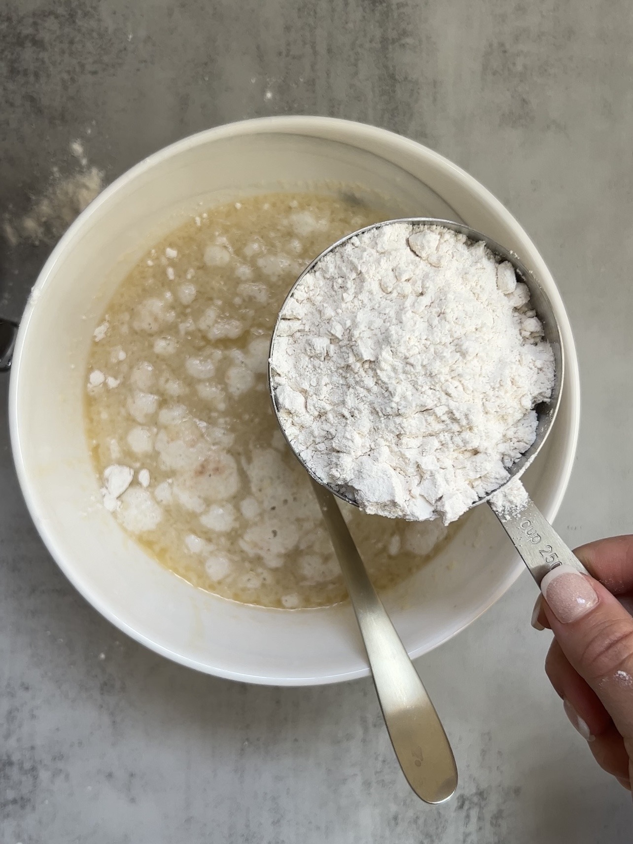 adding the flour to the coffee cake cupcake batter