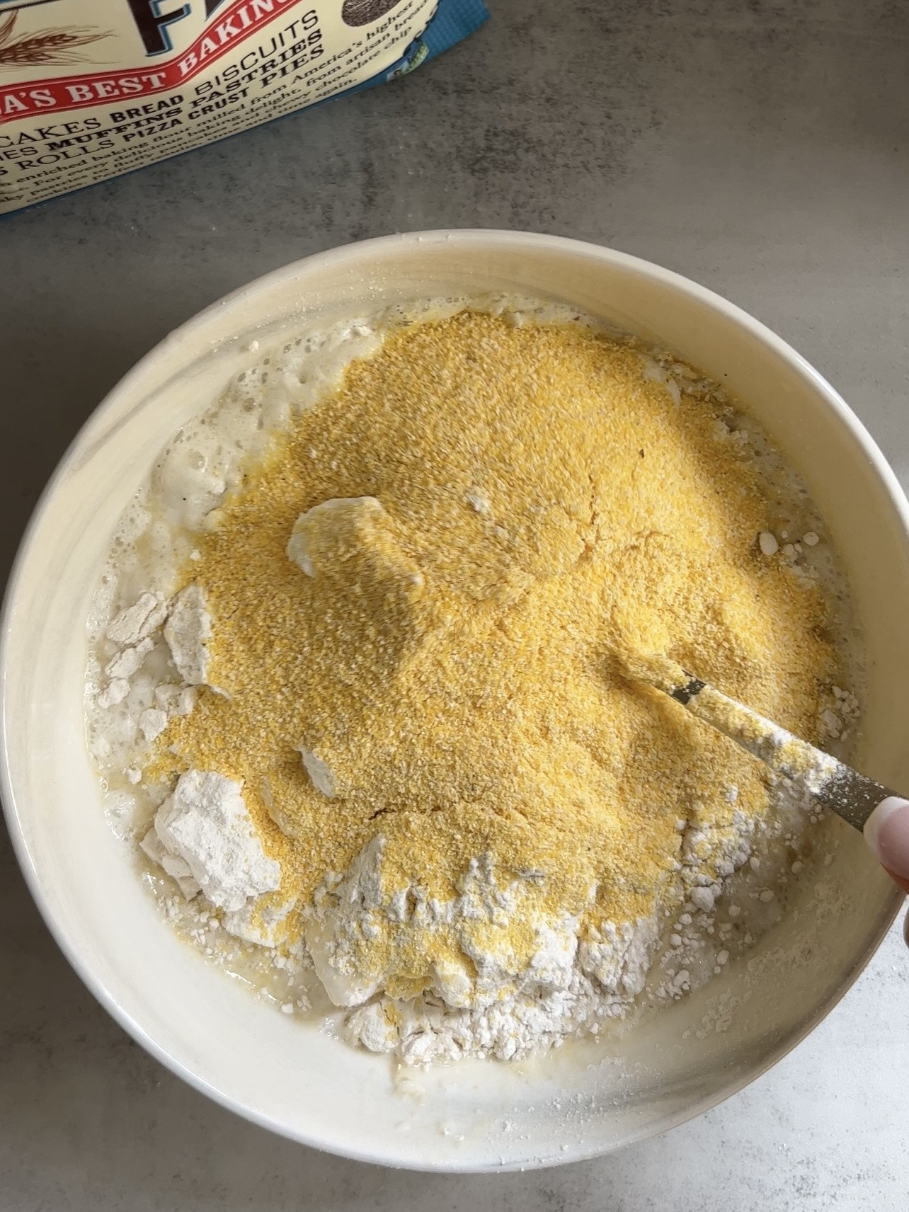 mixing the blueberry cornbread ingredients