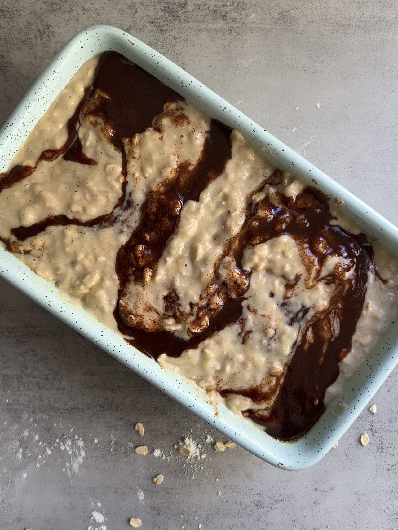 folding the filling in to make a cinnamon swirl in the banana bread