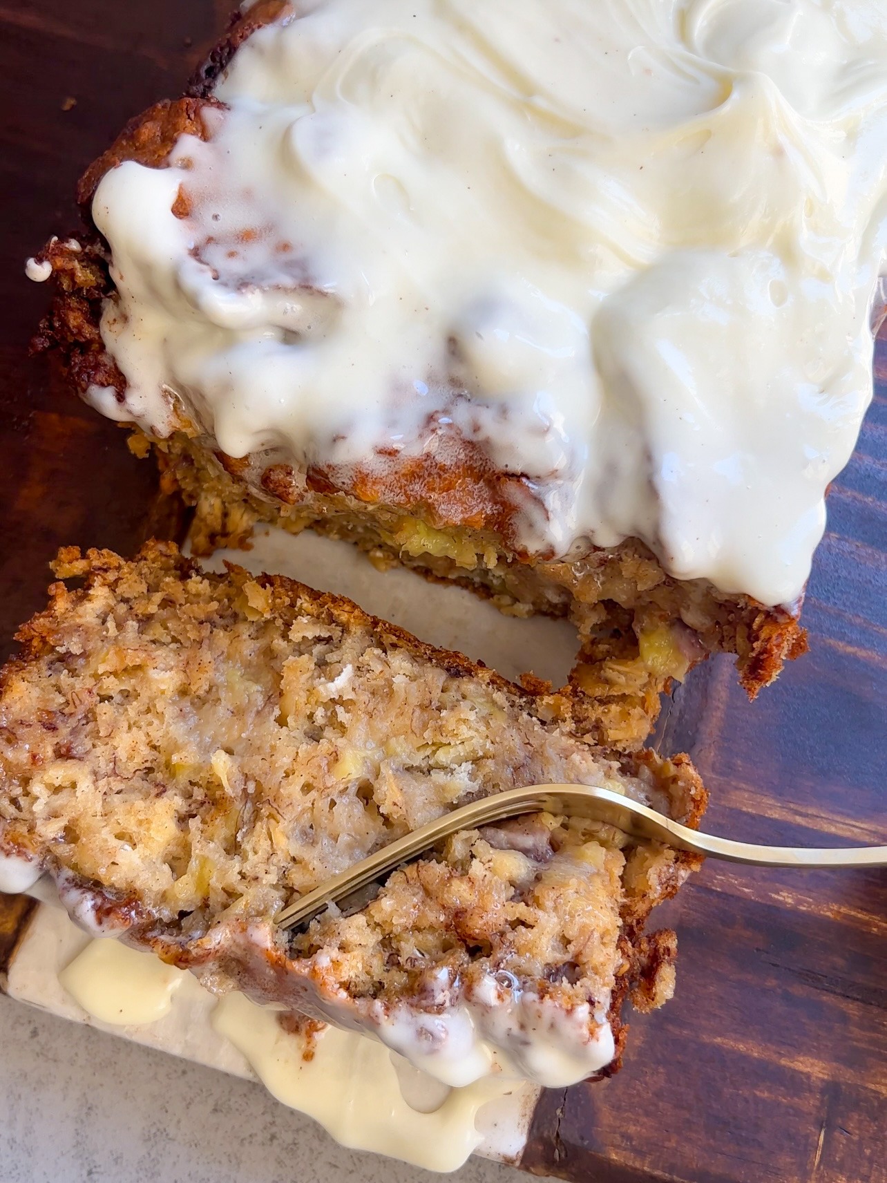 a fork slicing into the Cinnamon Roll Banana Bread