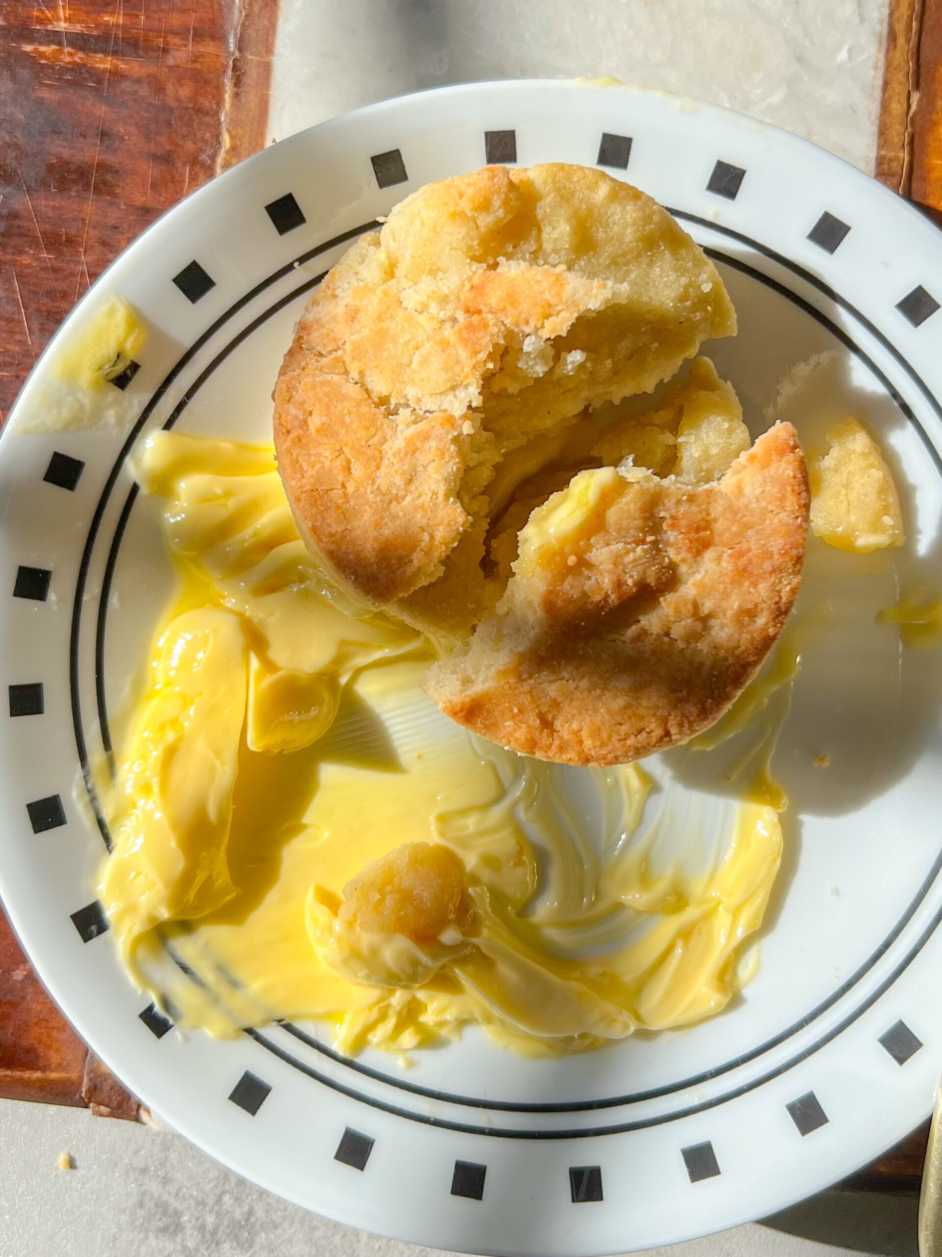 gluten-free biscuit with butter on a plate