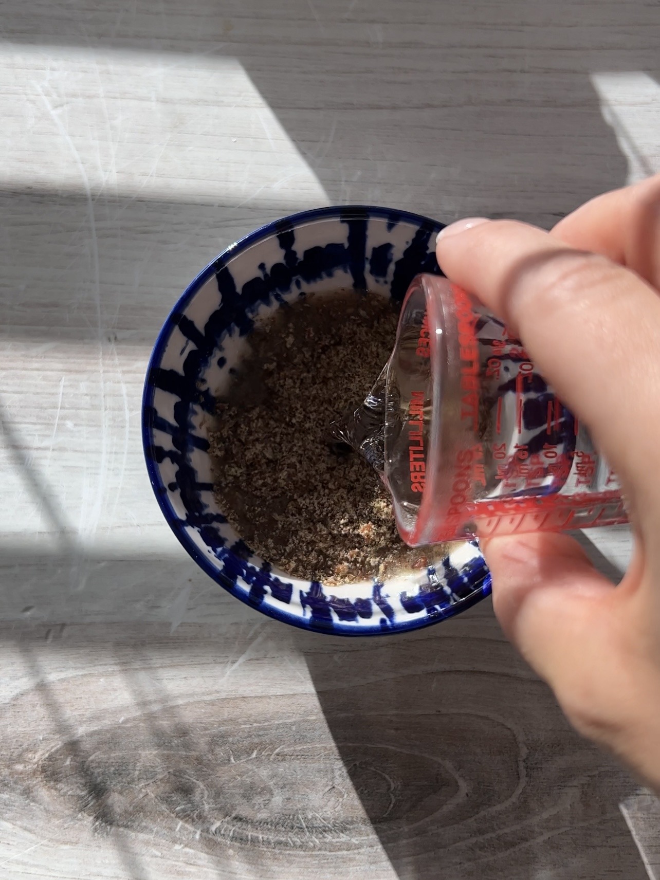 alyssa's healthy oatmeal bites - making the flax eggs by mixing the organic ground flax seeds with warm water.