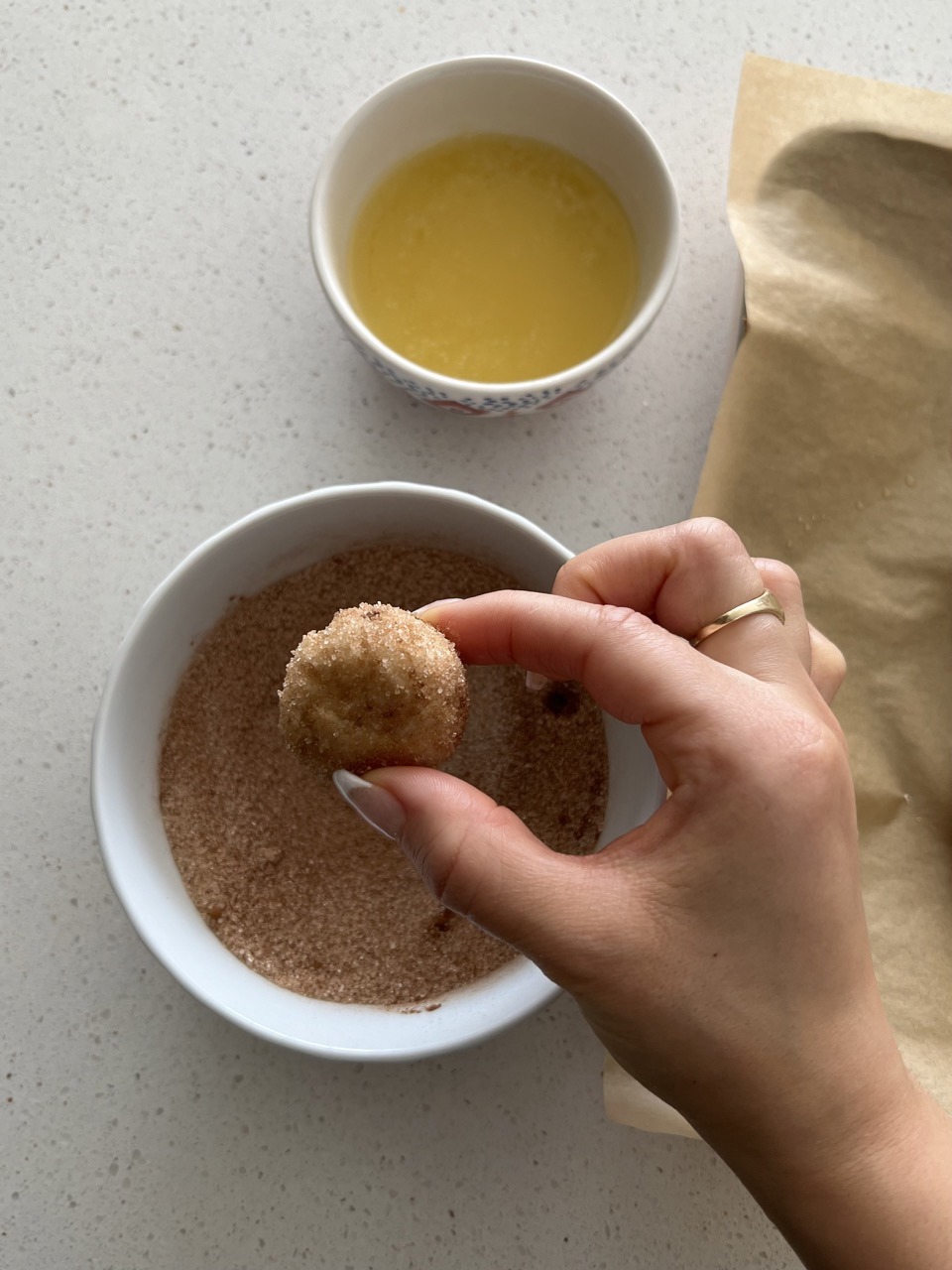 Bagel bite after being dipped in cinnamon sugar mixture. 