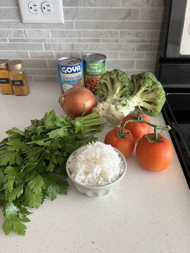 Ingredients needed for coconut curry casserole on a kitchen counter. 