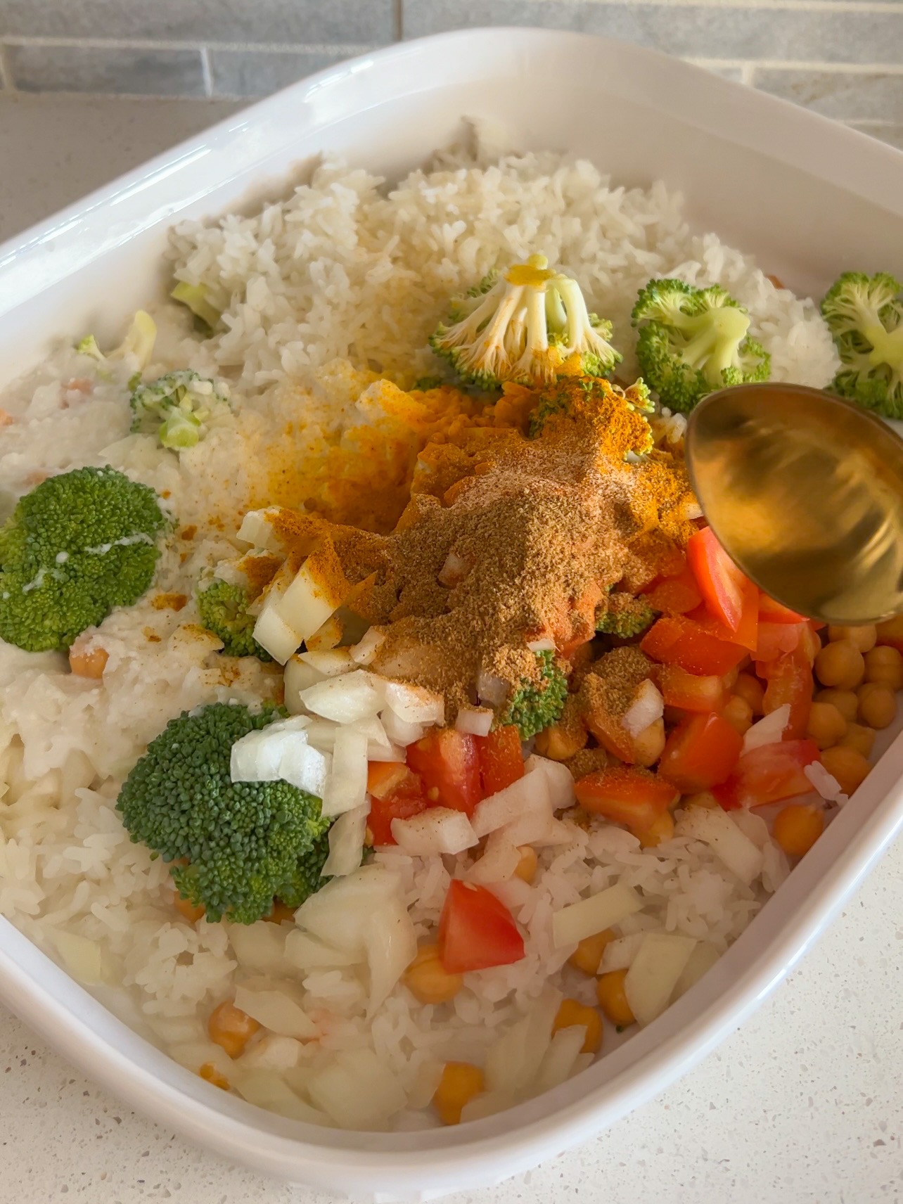 Mixing all of the ingredients together in the casserole dish. 