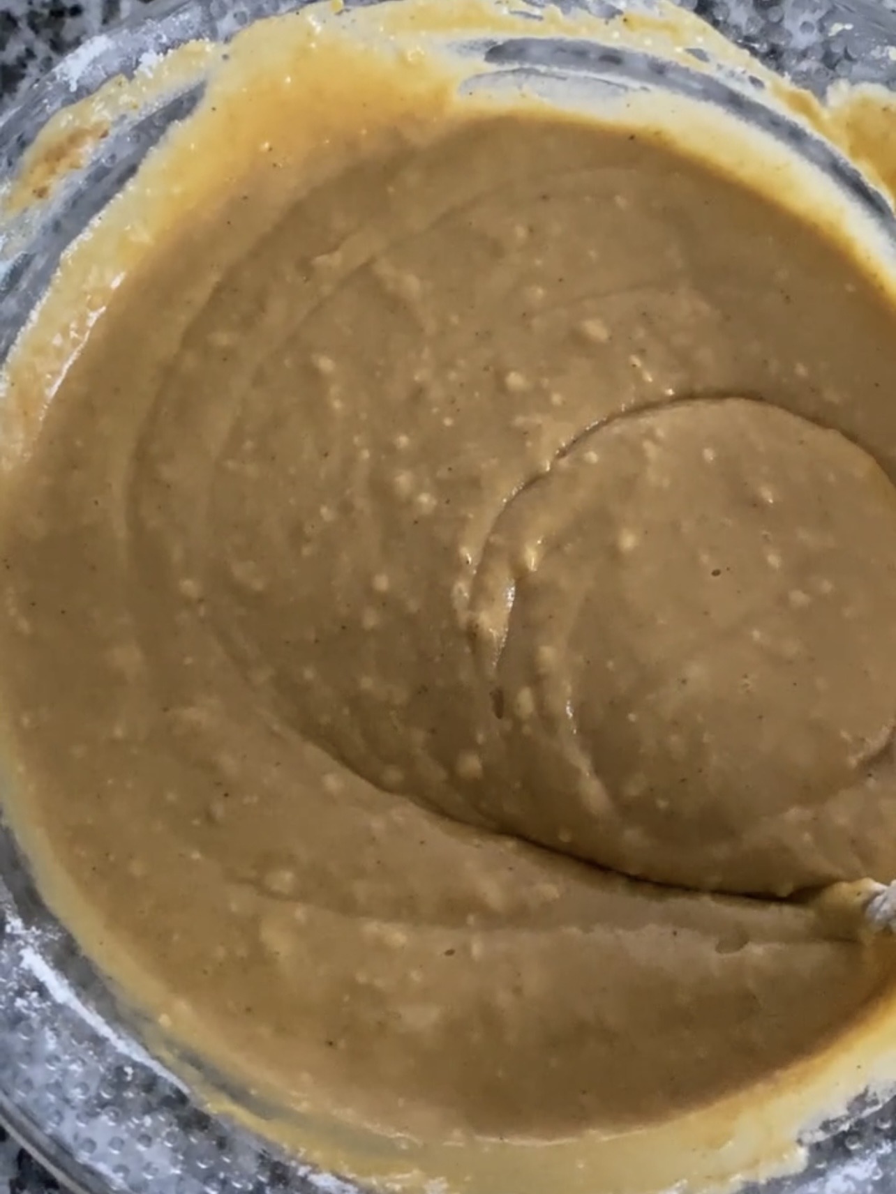 Pumpkin donut batter in a mixing bowl. 