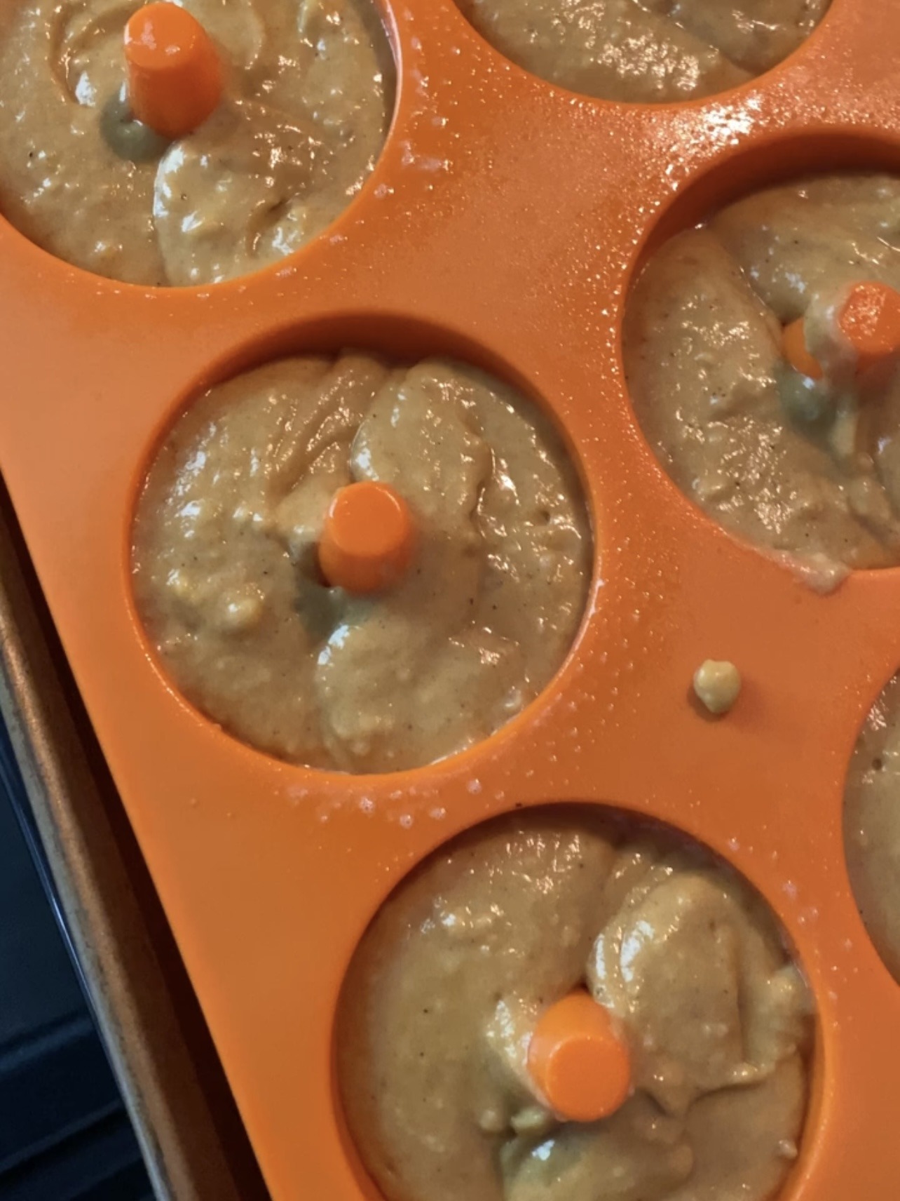 Donut pan with batter in it, before baking. 