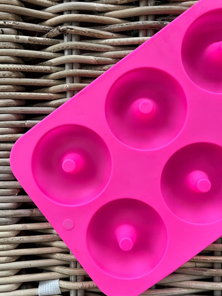 Pink silicone donut pan.