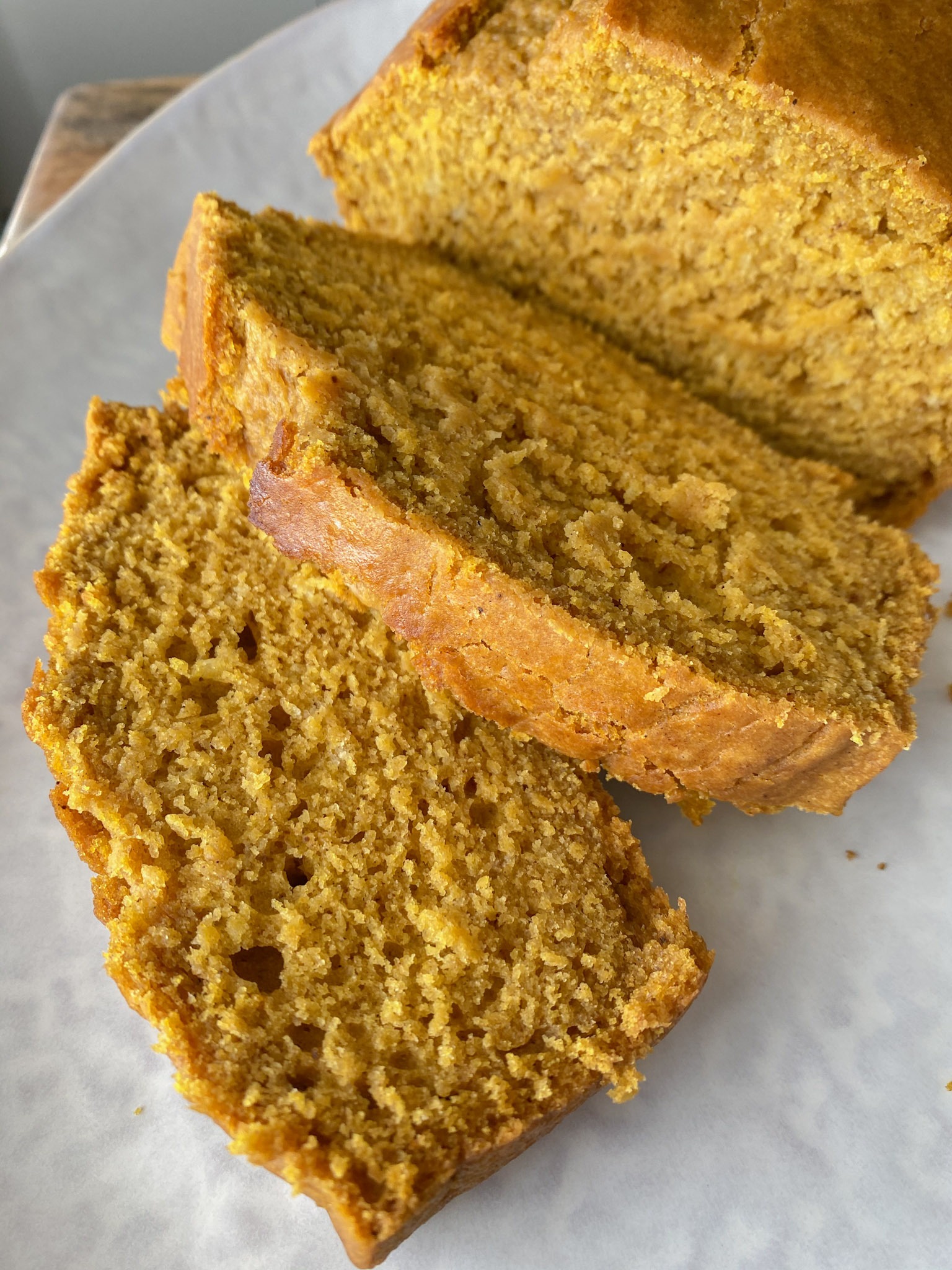 Gluten free pumpkin bread sliced on a plate.