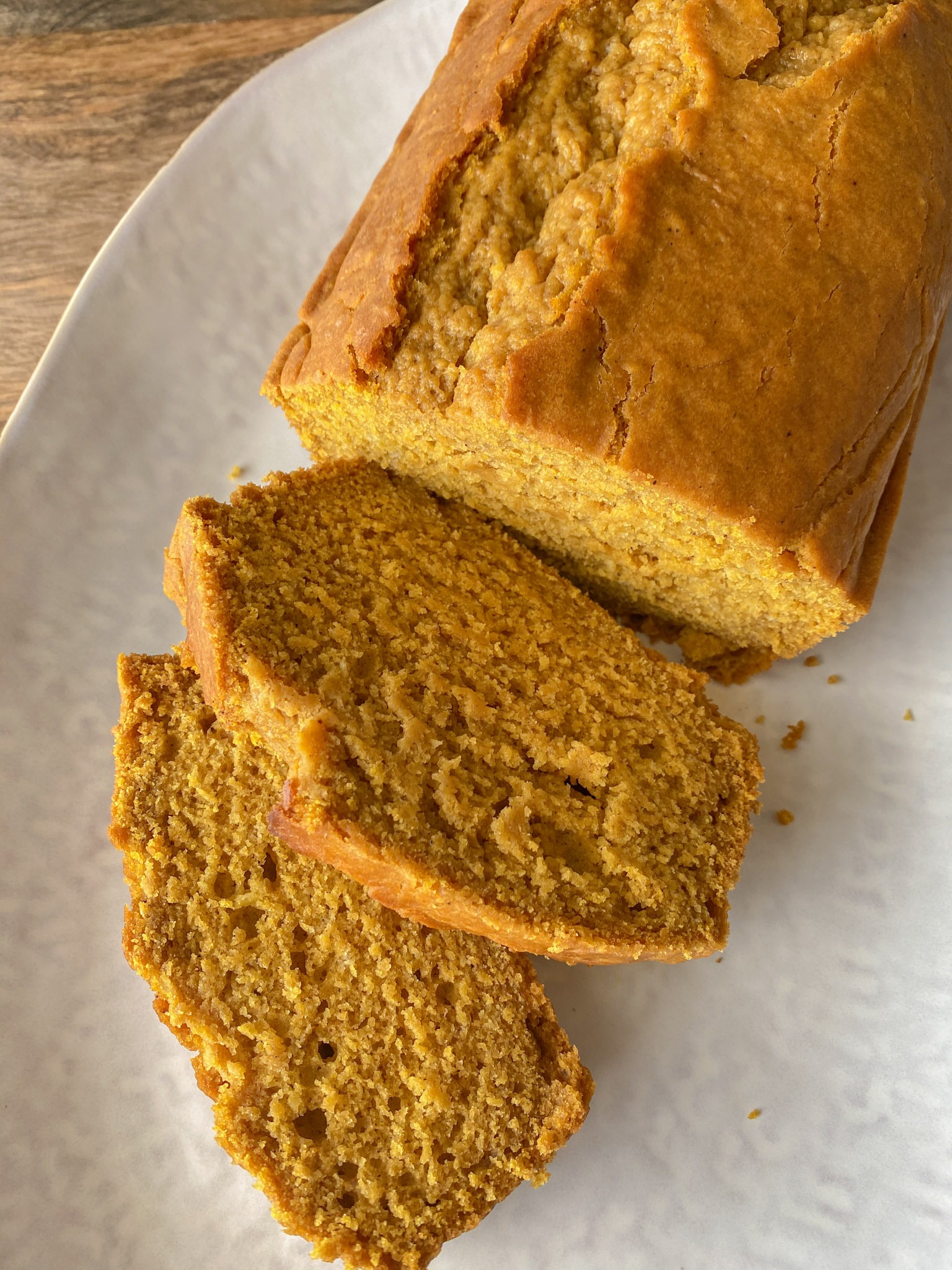 Sliced pumpkin bread on a plate.