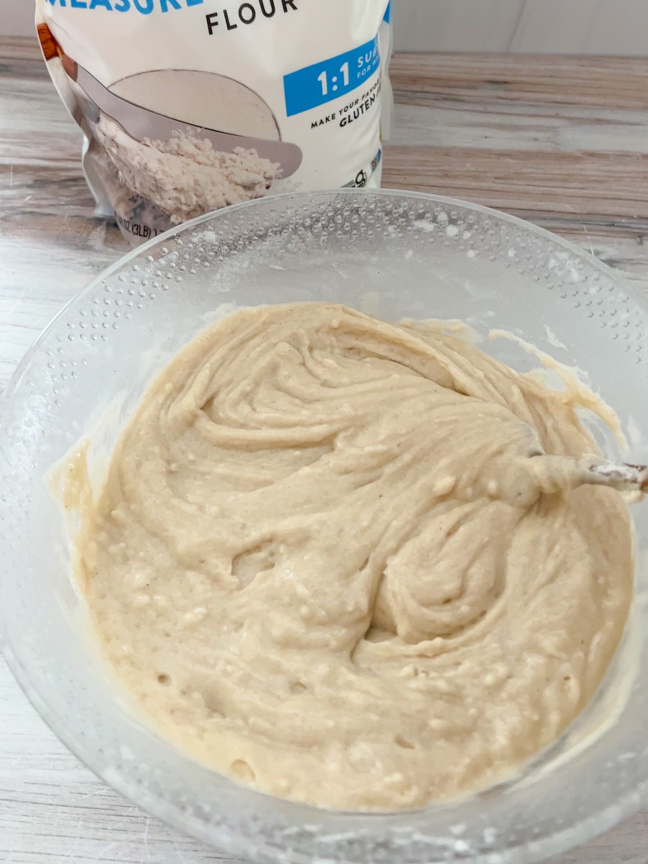 Step 2: To make the lemon cake batter, mix the almond milk, lemon juice, melted vegan butter, sugar, vanilla, lemon extract (if using) baking powder, and baking soda together. The vegan cake batter will begin to foam. This is ok, quickly add the regular or gluten-free flour into the bowl. 