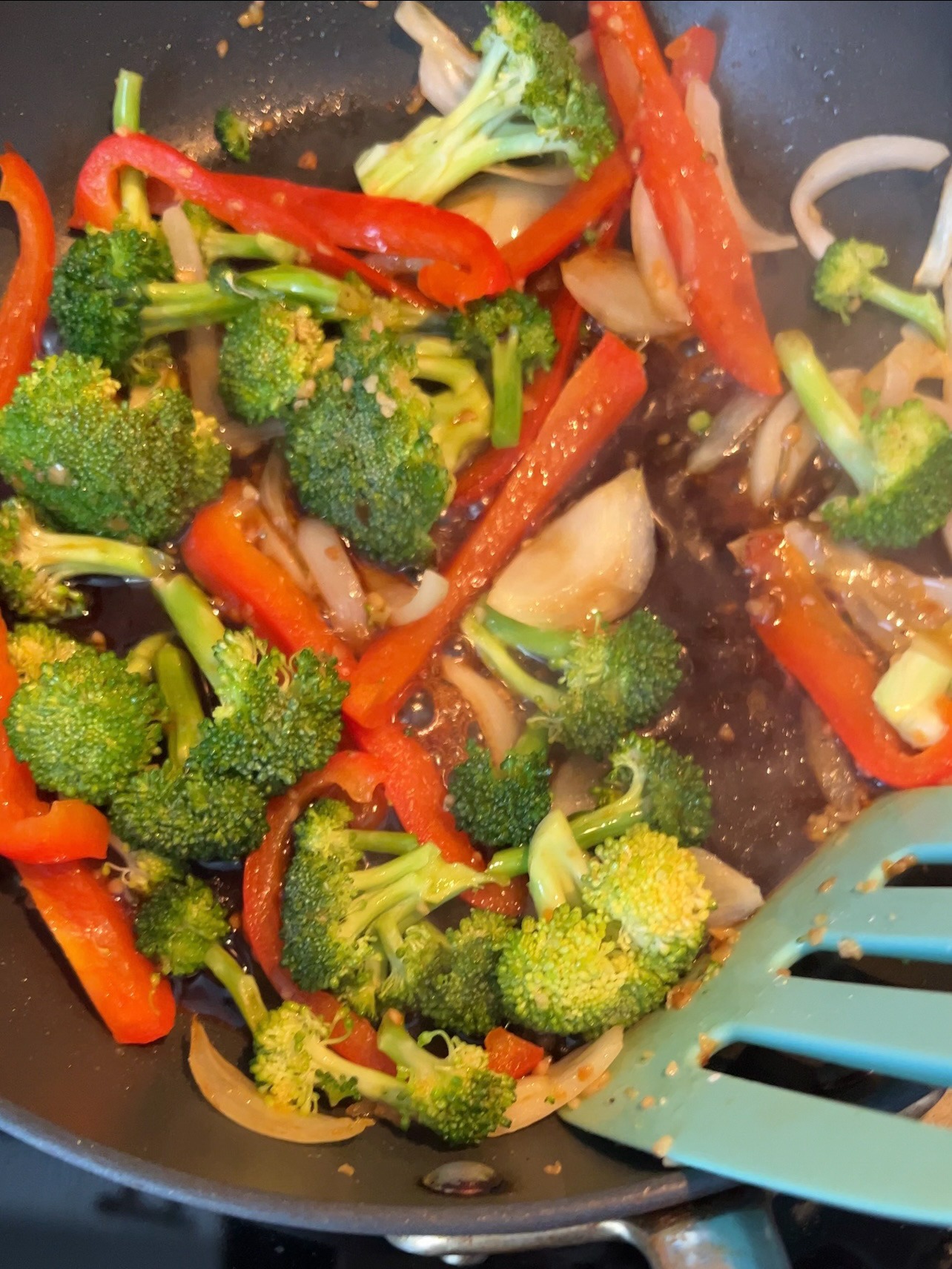 Sautéing veggies in a skillet.