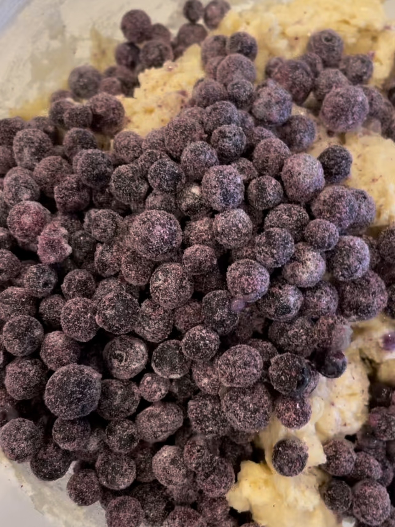 Biscuit dough with frozen blueberries. 