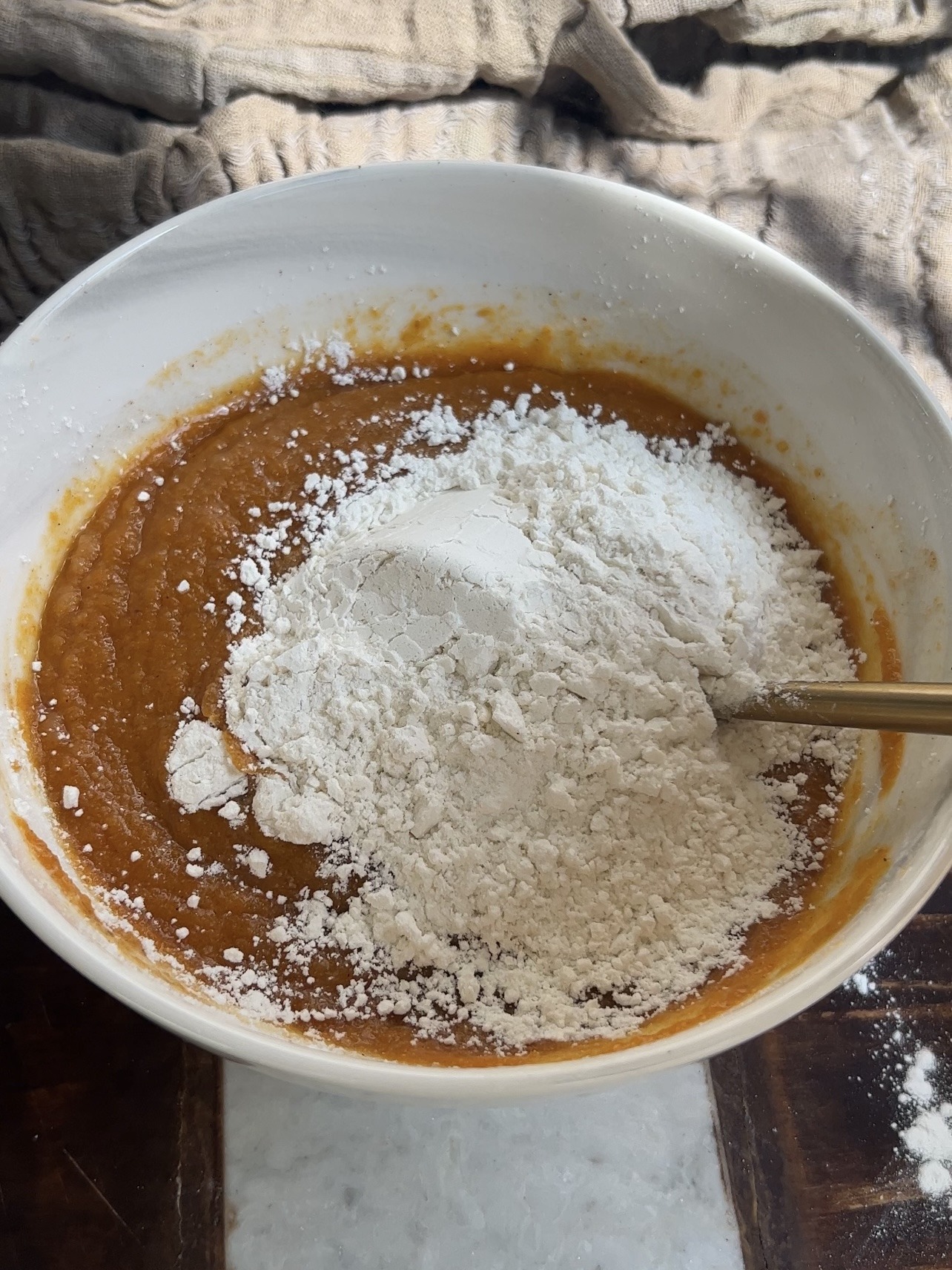 mixing the ingredients for chocolate chip pumpkin bars
