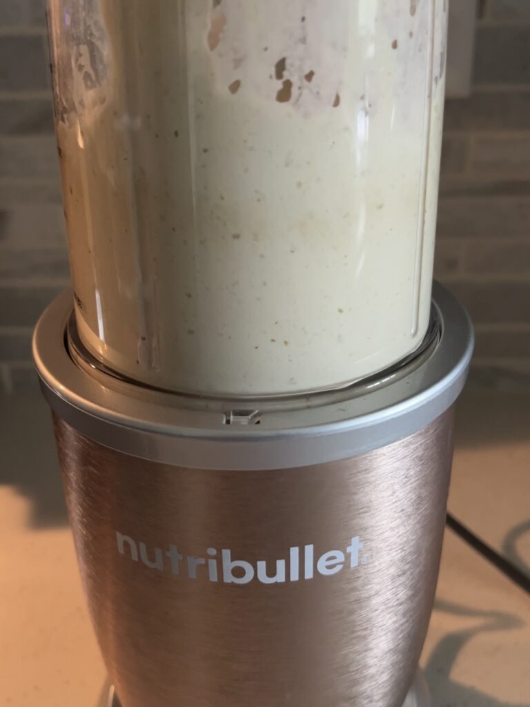 caesar dressing in the blender after being blended. 