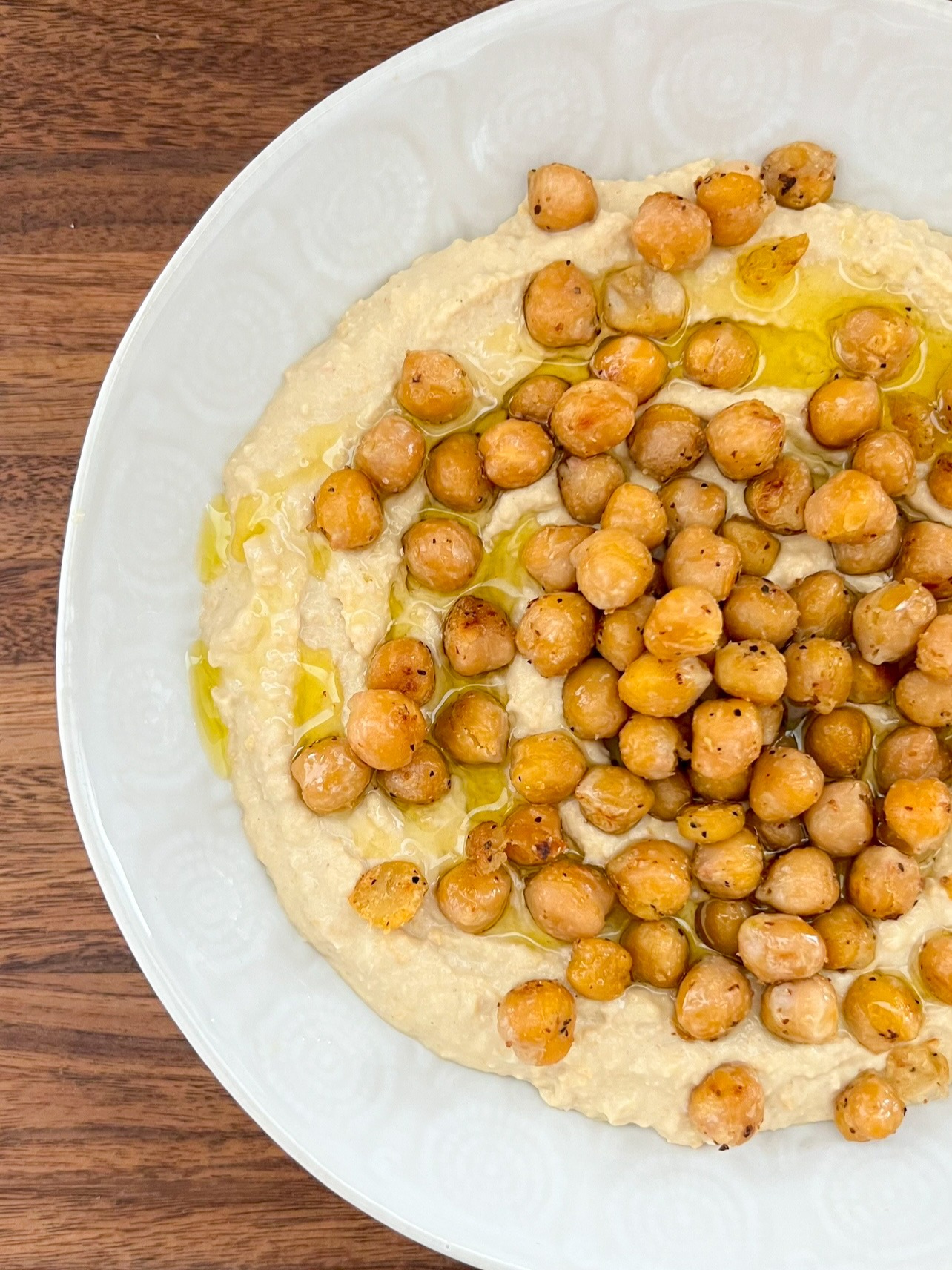 Creamy hummus topped with crispy chickpeas.