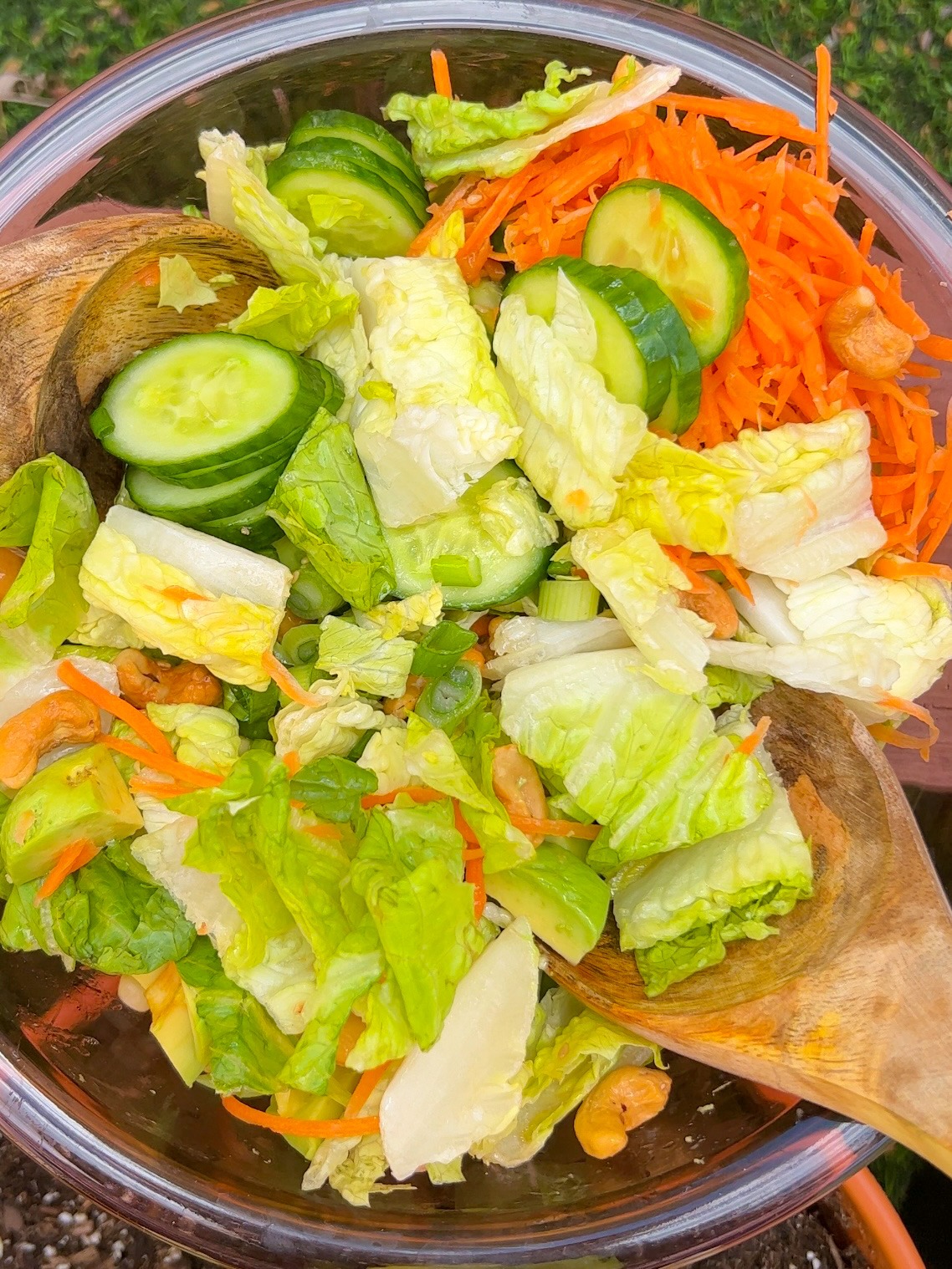 tossing the cashew crunch salad