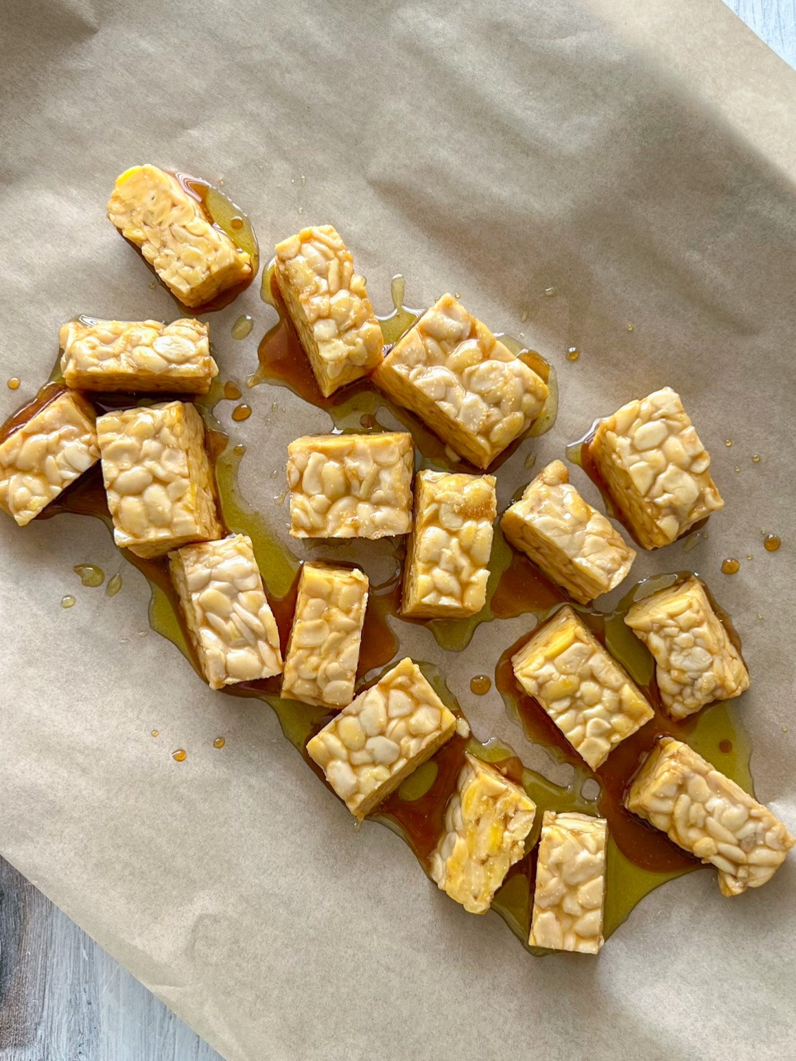 marinated tempeh on the baking sheet