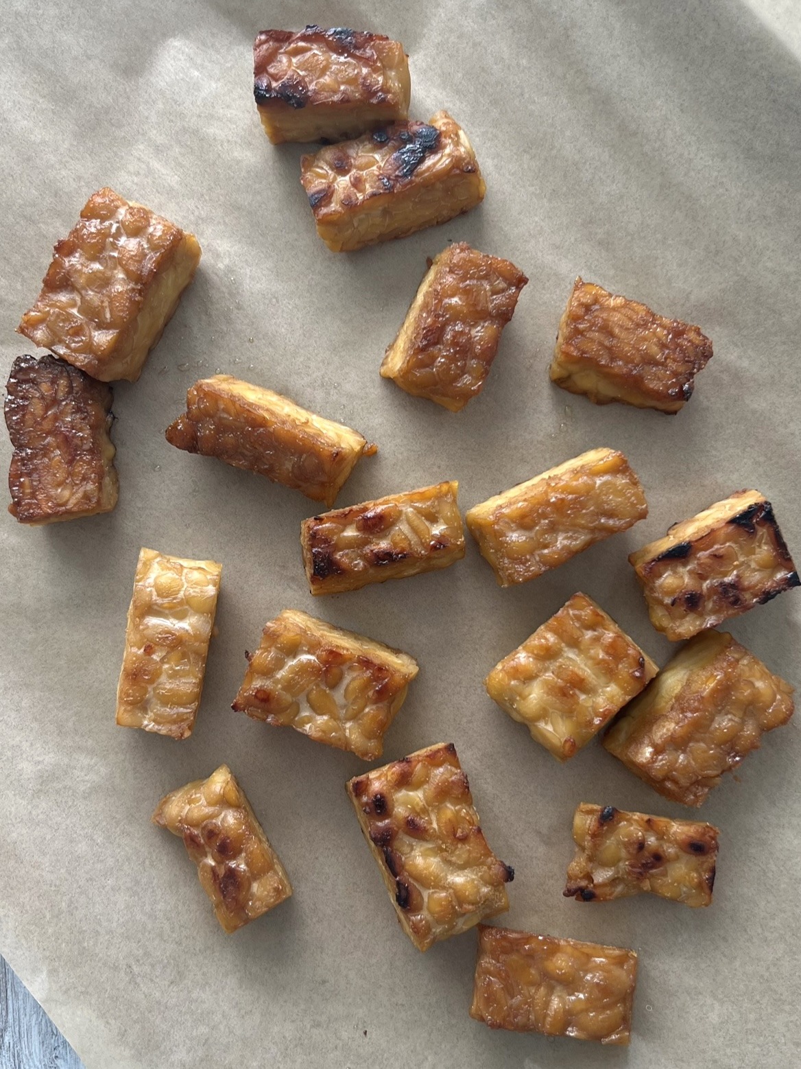 tempeh after being baked on the baking sheet. 