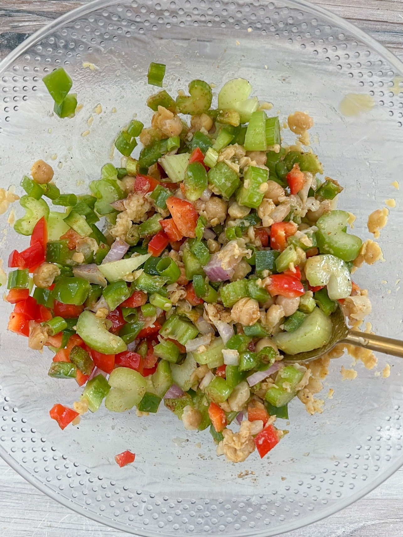 Stirring chickpeas with veggies.