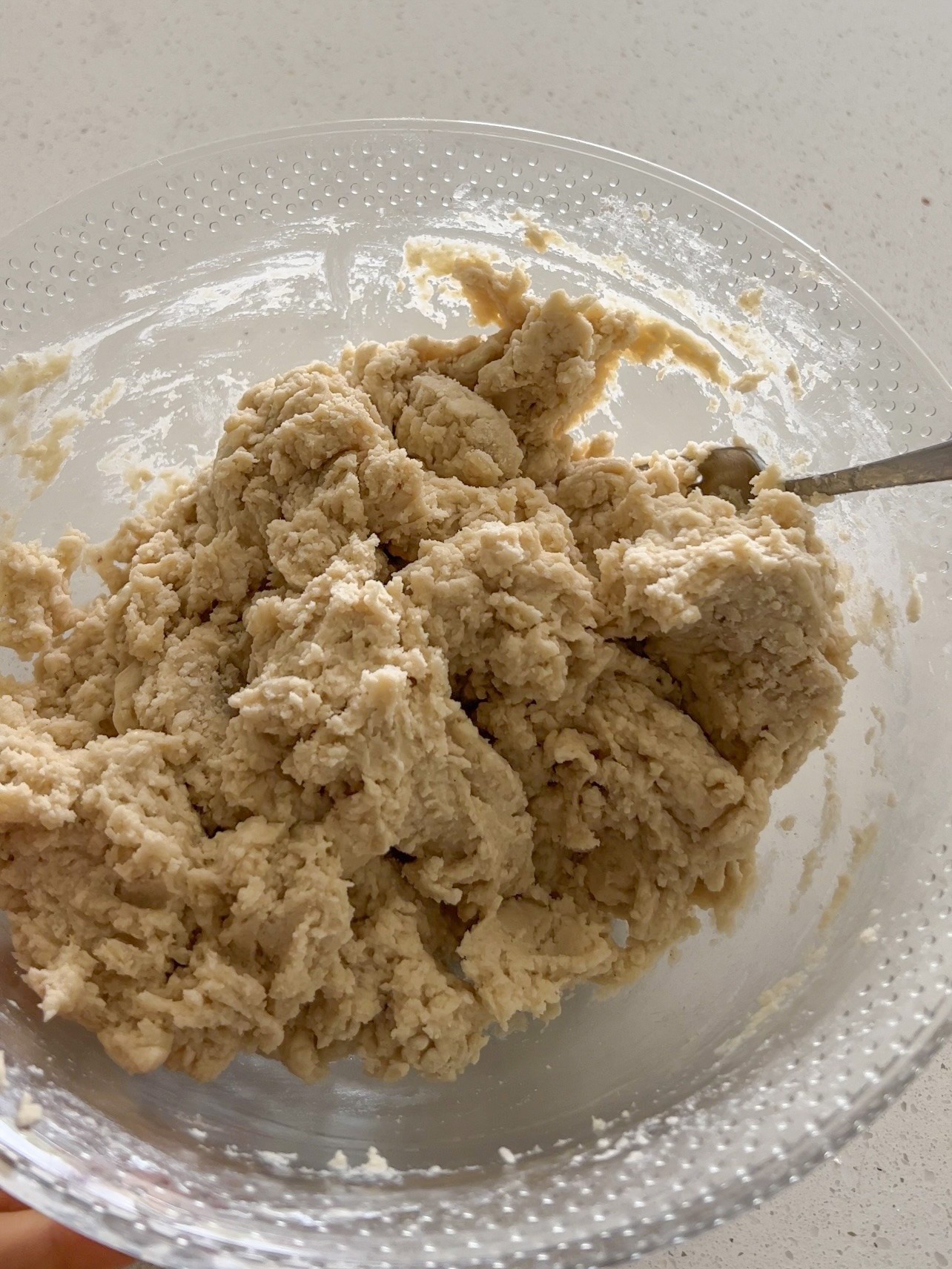 Adding flour to melted butter and mixing with a fork.