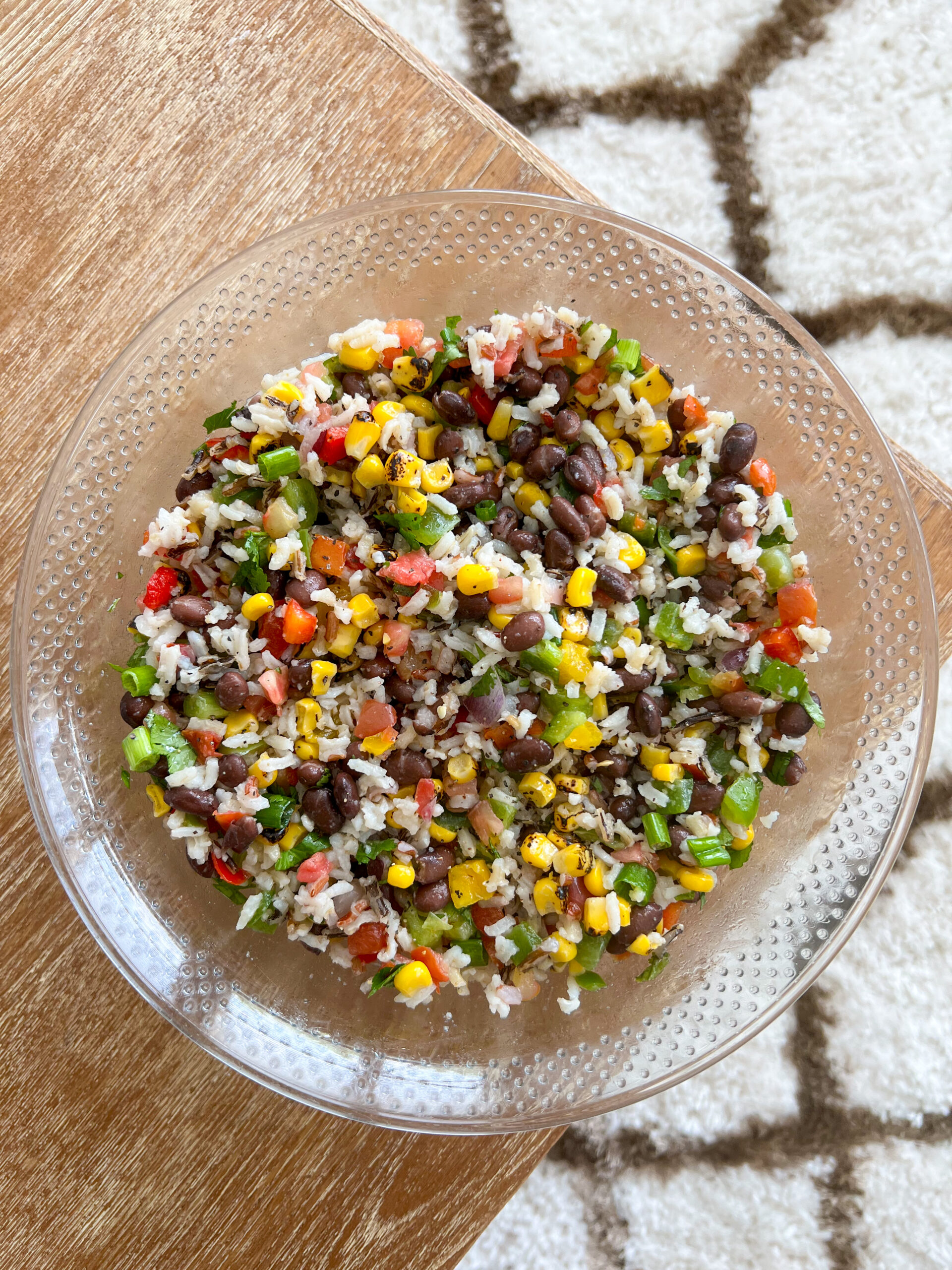 wild rice and black bean salad after being mixed in a mixing bowl. 